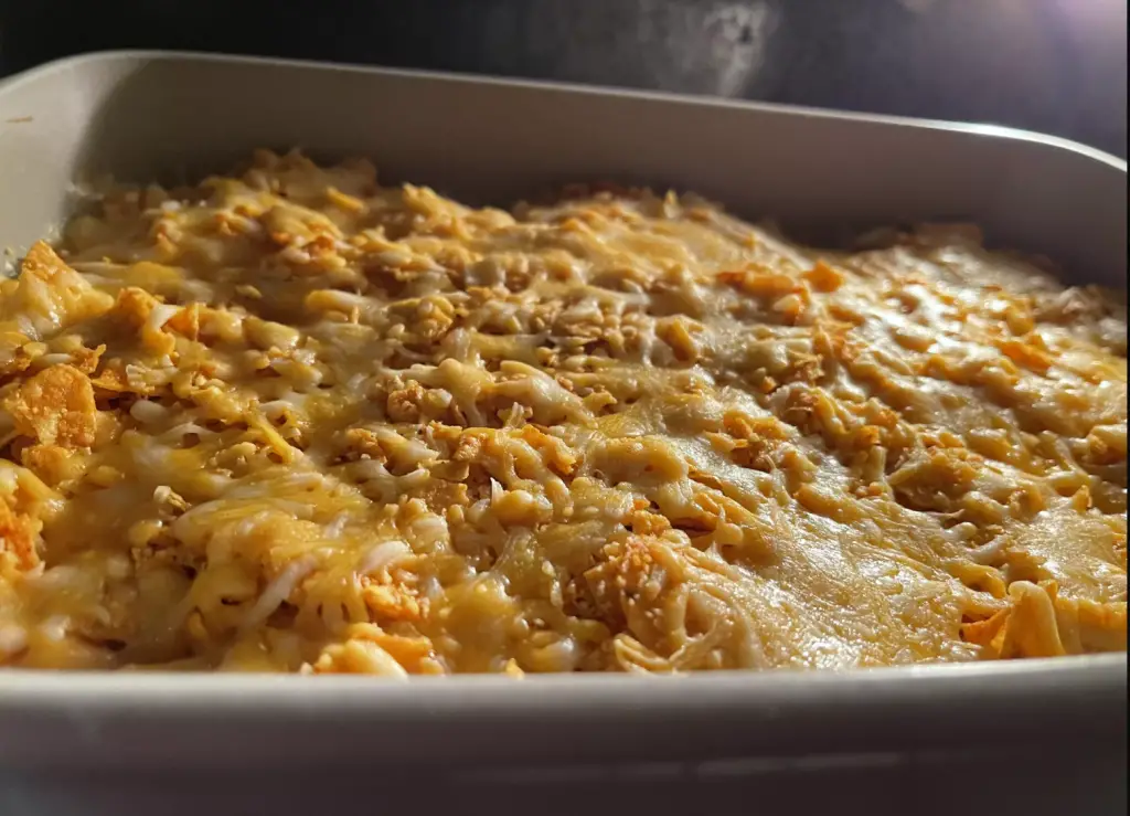 Indulge in our Cheesy Doritos Chicken Casserole. A crowd-pleasing, easy-to-make dish that's full of flavor!